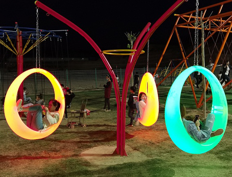 Moon-shaped glowing swing