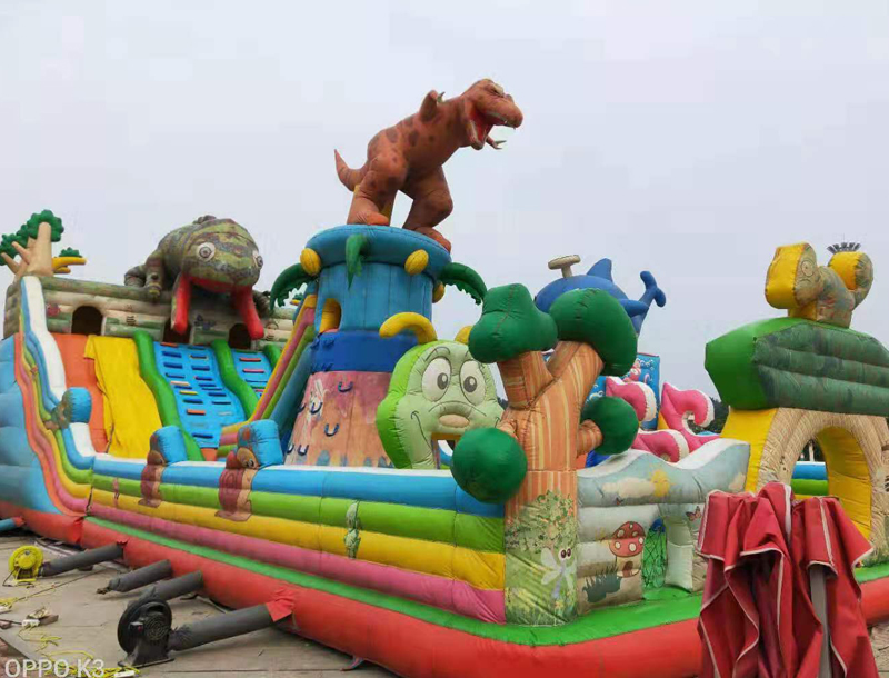 Large Dinosaur-Themed Inflatable Castle Slide
