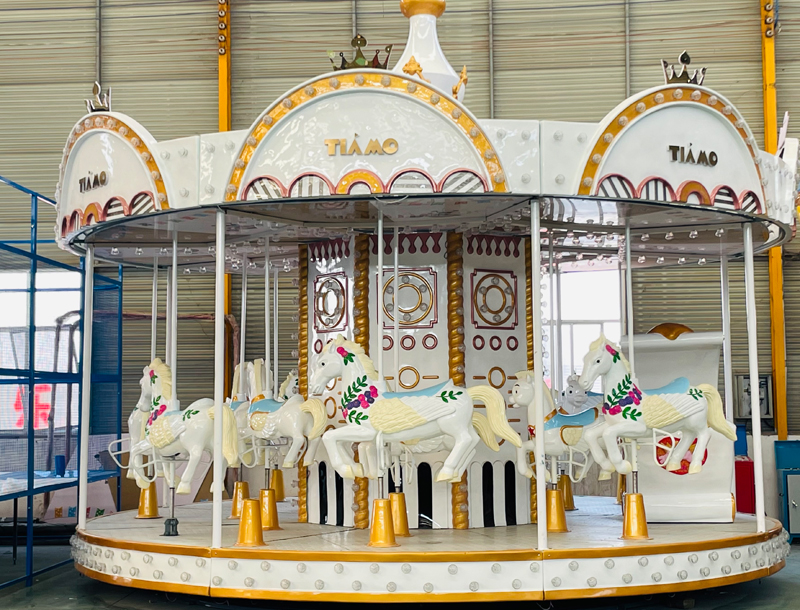 white carousel amusement park rides
